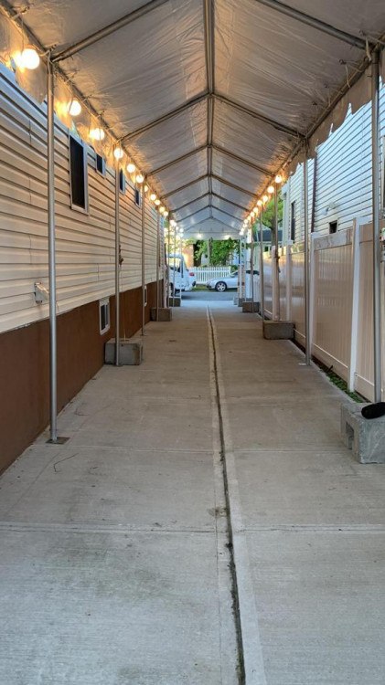 Tent rentals in New Rochelle, NY: Elegant wedding tent setup with drapery.